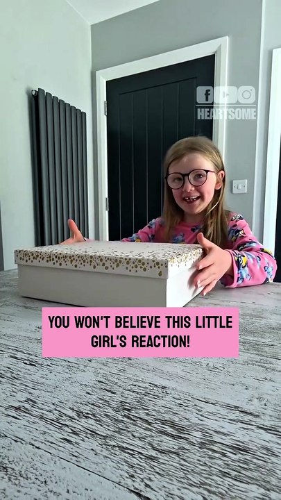 The birthday girl can't hold back smiles when she discovers her dream concert gift
