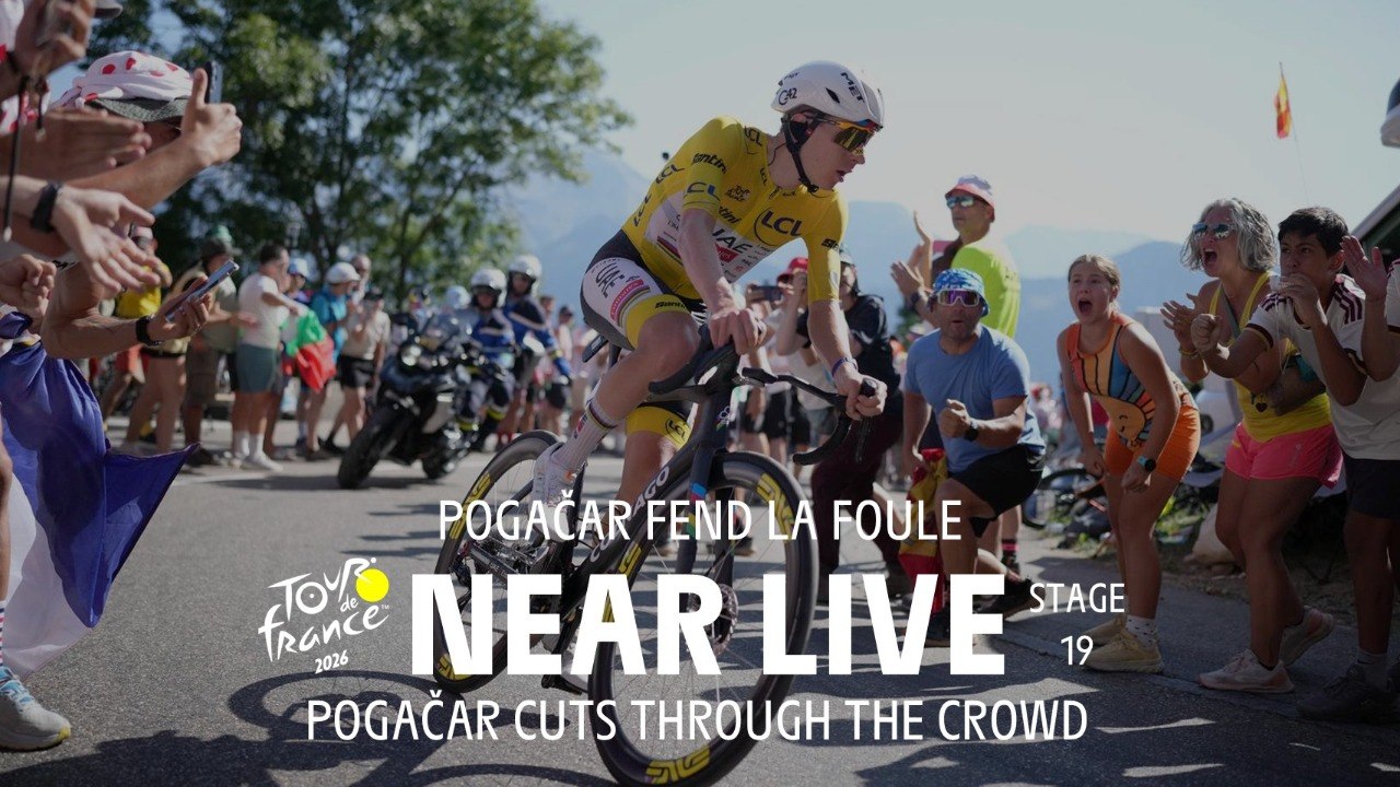 Pogačar cuts through the crowd. - Stage 19