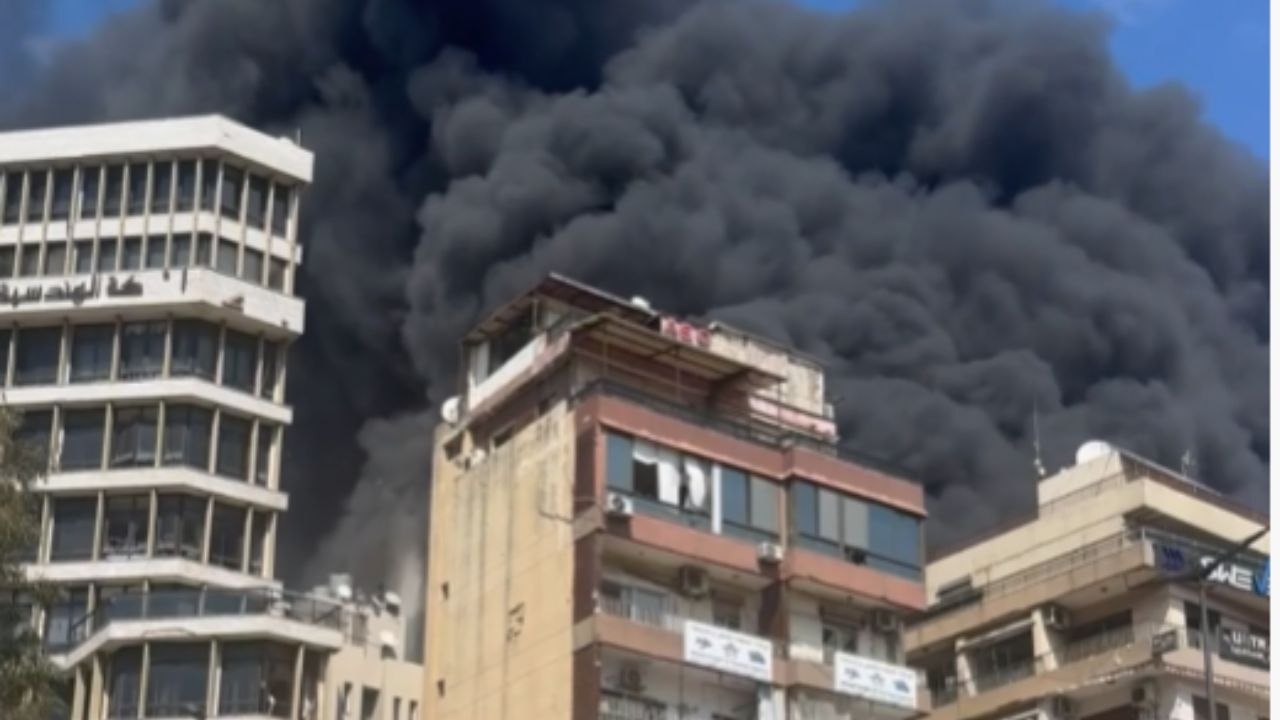 Smoke And Debris Rise After Strike Hits A Tower In Corniche al-Mazraa