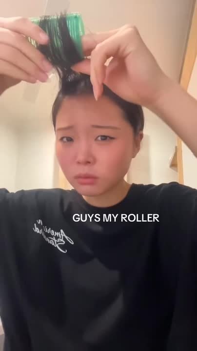 Woman's Hair Spike up After Removing Roller