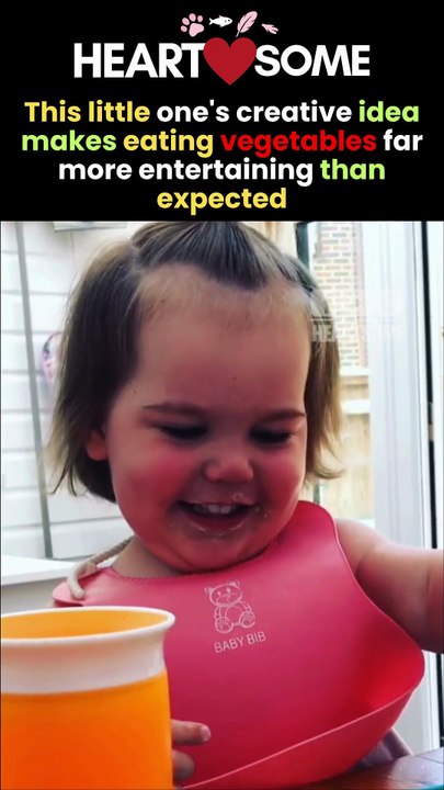 The little girl has a heartwarming moment while showing off her pea-eating idea