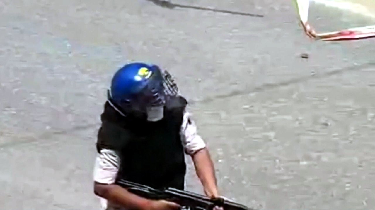 India suspends policeman for firing AK-47 at student protesters