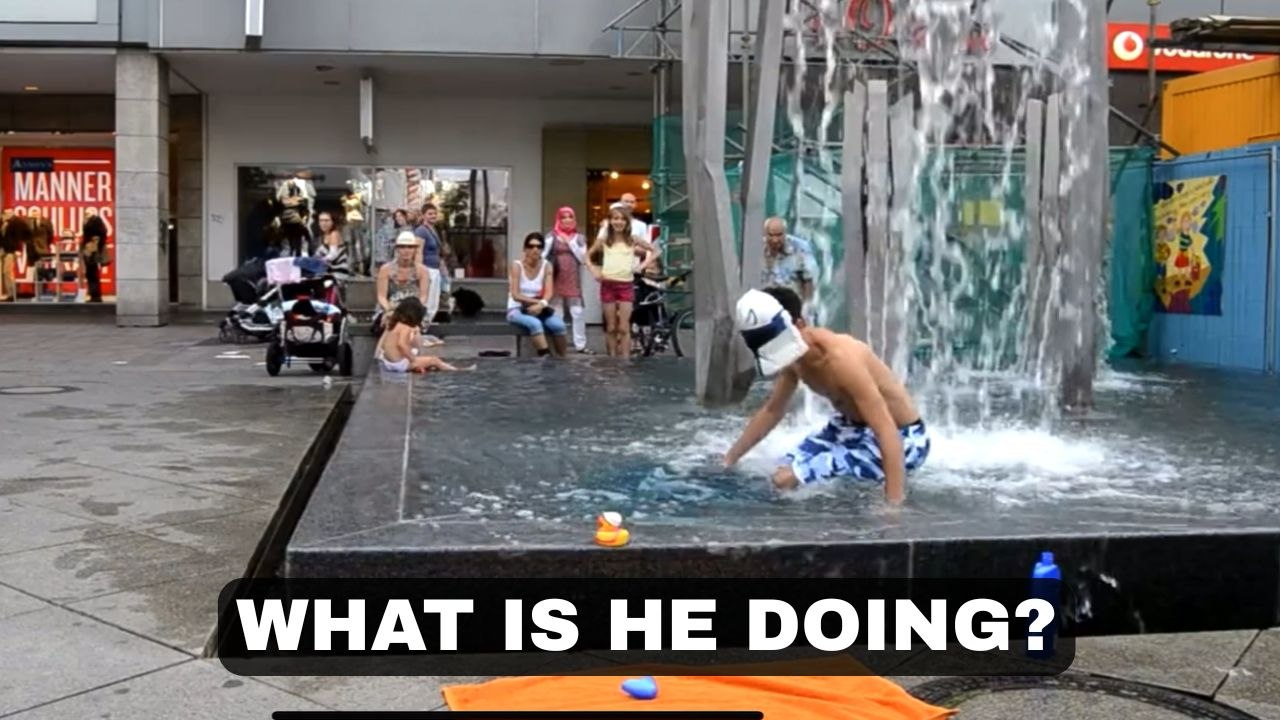 Man in Mask Jumps into Fountain, Amuses Bystanders