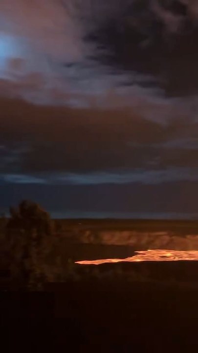 Towering Lava Fountain Erupts Beneath Glowing Full Moon