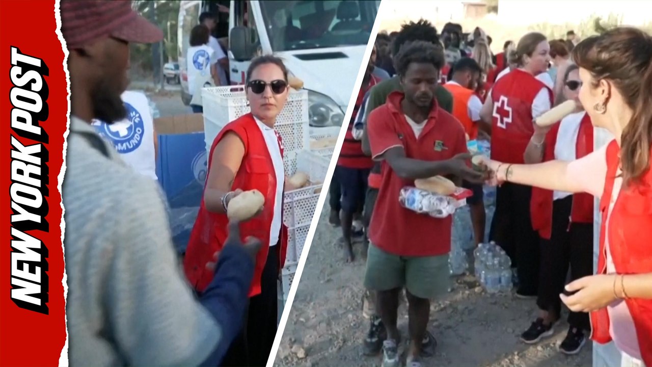 African migrants who stormed Spanish border into Ceuta given Red Cross handouts