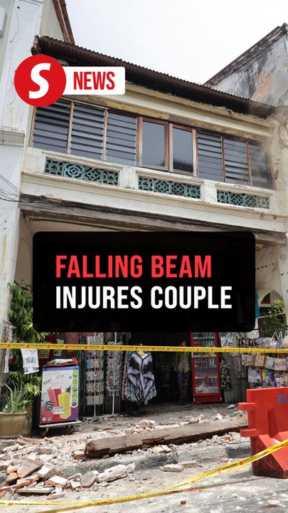 Two tourists injured by falling building debris in George Town