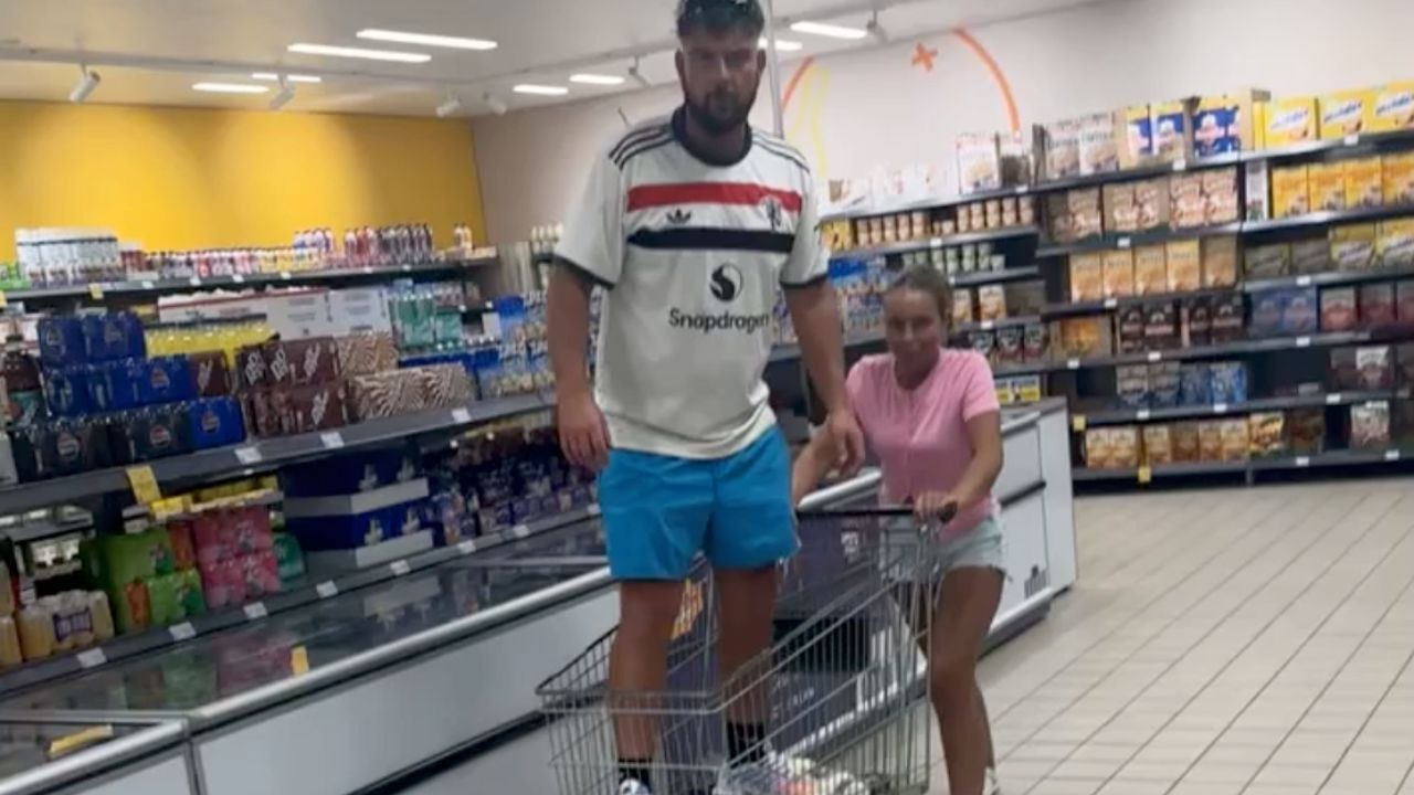 Boy Falls While Standing In A Shopping Cart