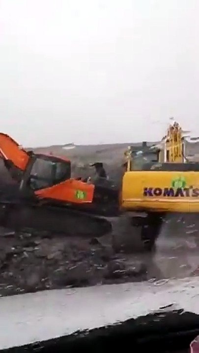 Heavy Machinery Action in Torrential Rain – Coa...