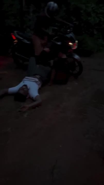 Man Slips In Mud While Approaching Motorcyclist