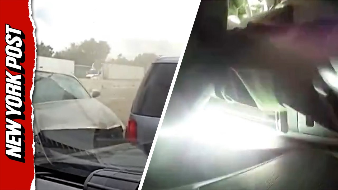 Driver plows into back of police car during traffic stop