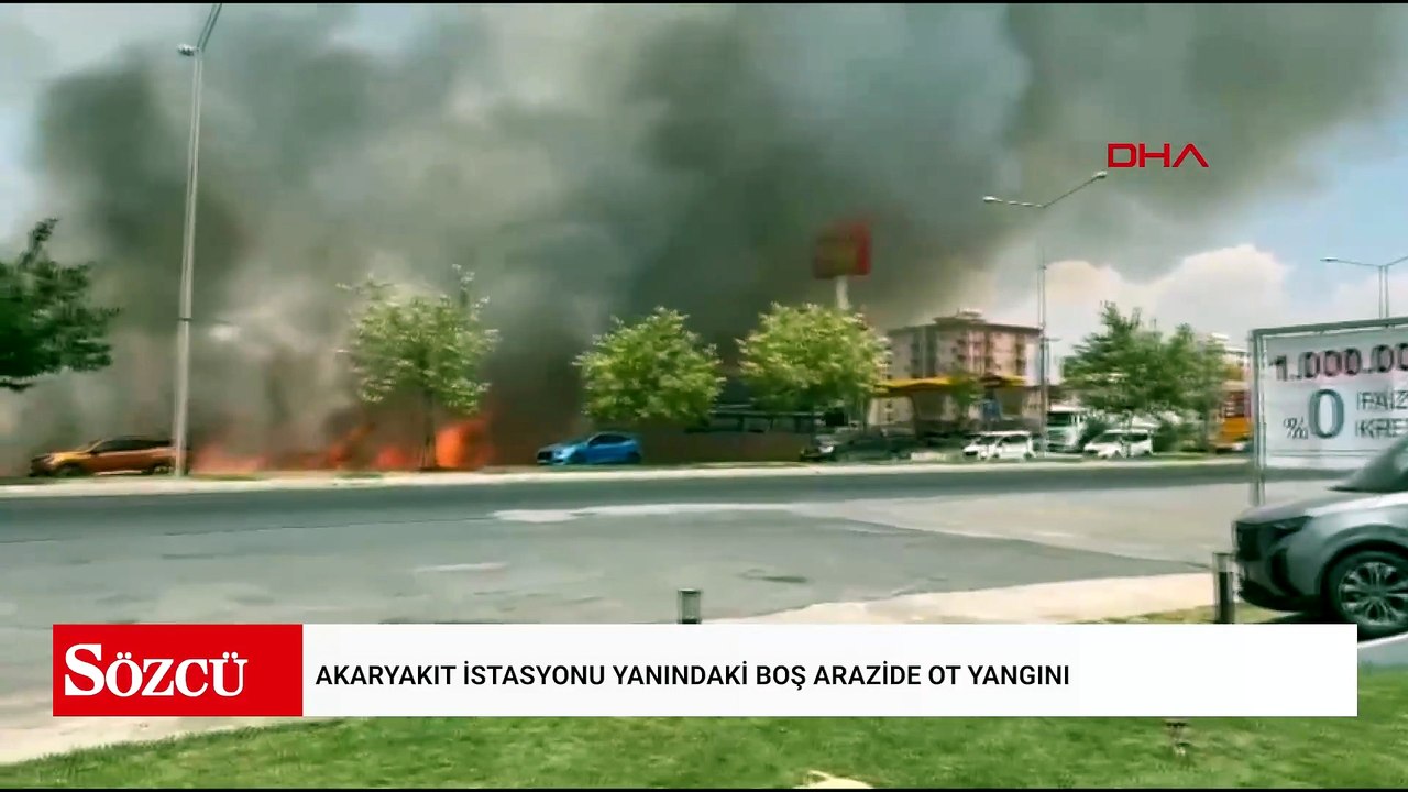 Akaryakıt istasyonu yanındaki boş arazide ot yangını
