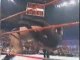 Big Show chokeslams Undertaker through the ring