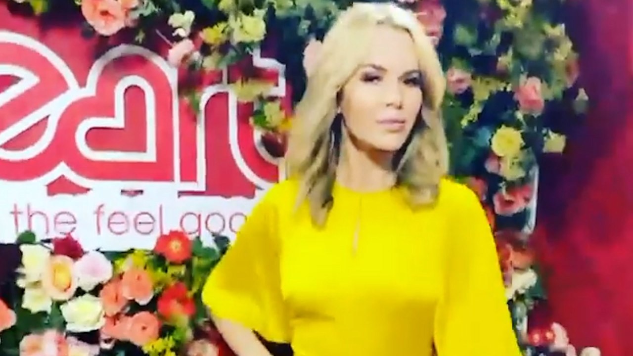 Amanda Holden struts in yellow satin dress