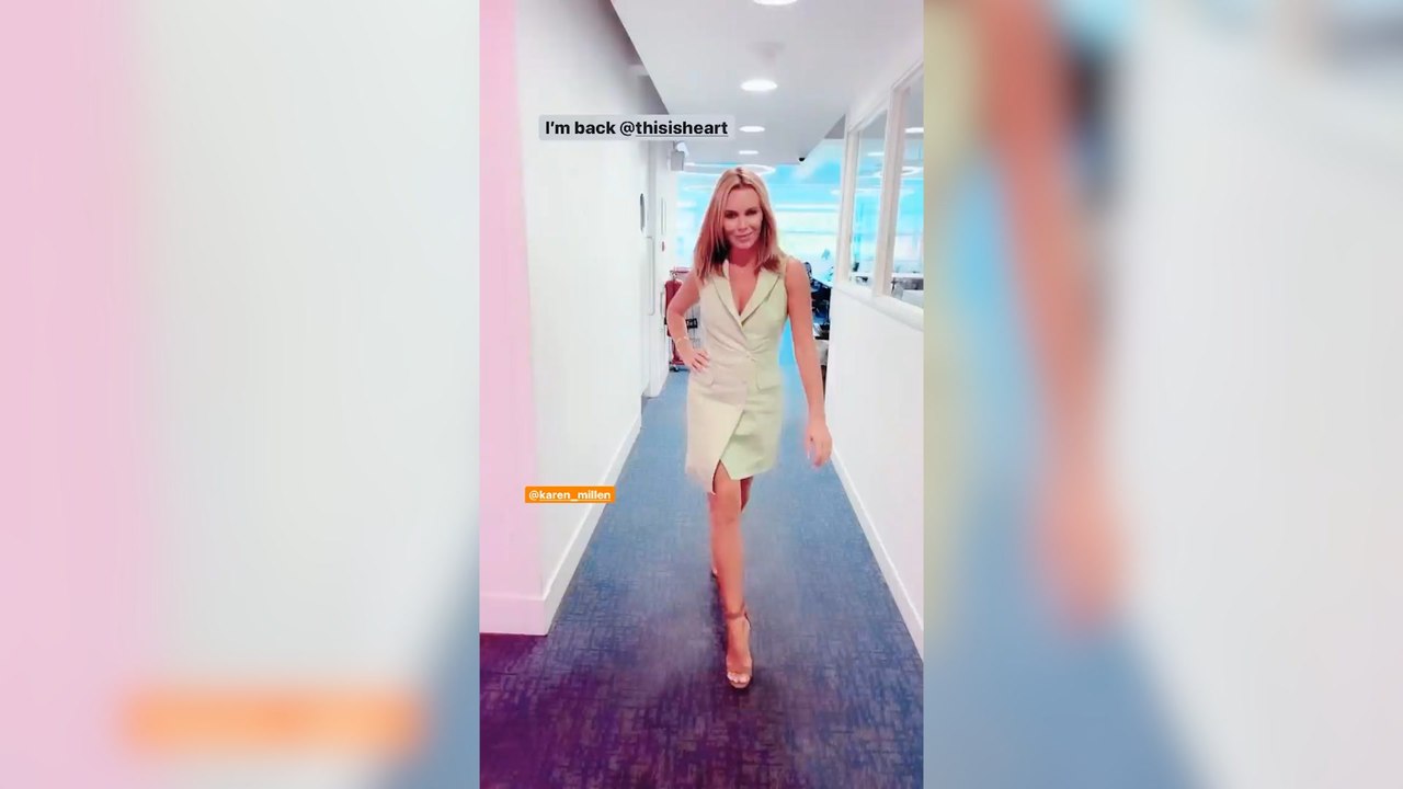 Amanda Holden struts through the Heart studios...