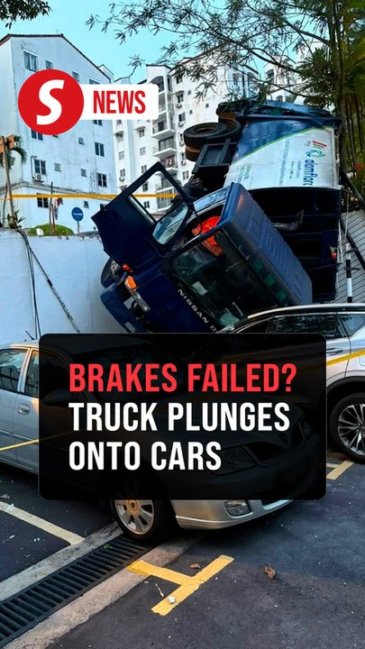 Runaway garbage truck crushes three cars at KL condo