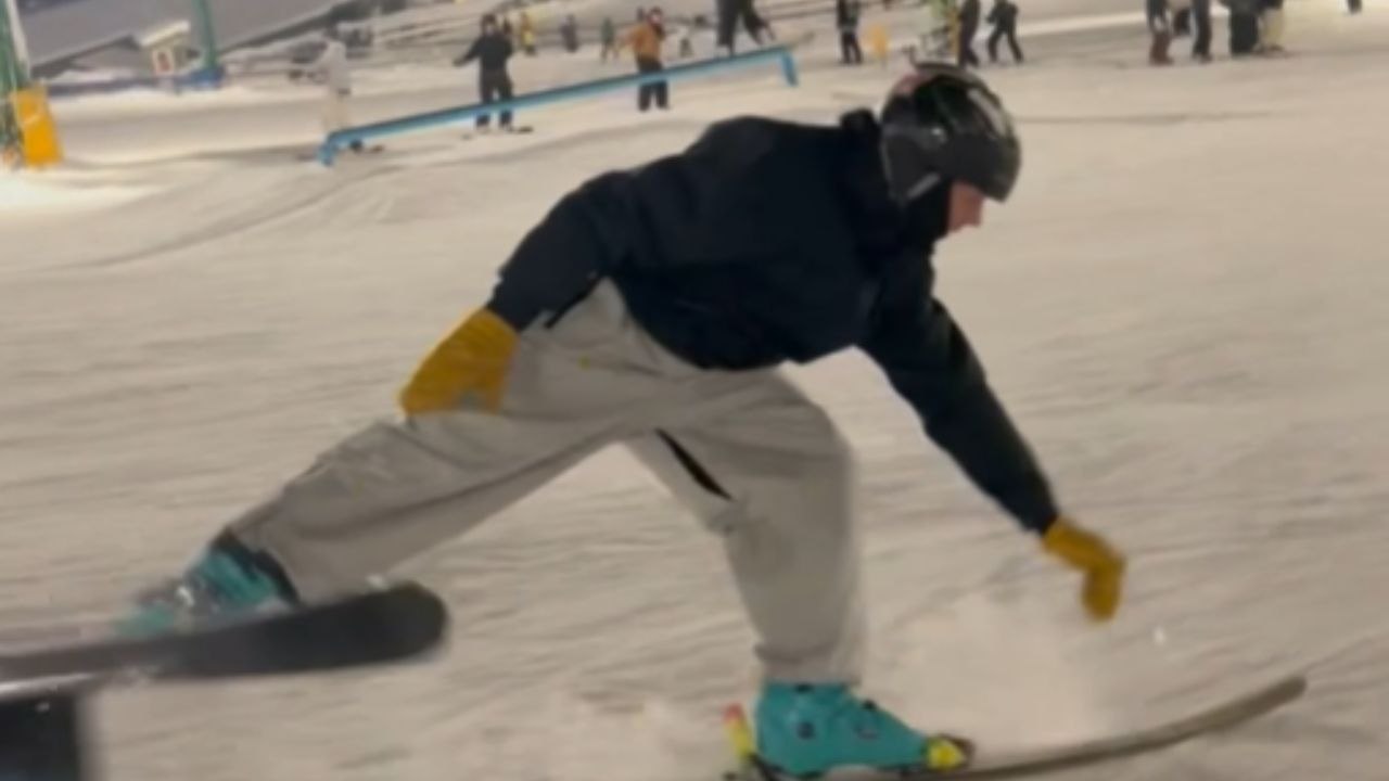 Skier Struggles to Maintain Balance on Stuck Ra...