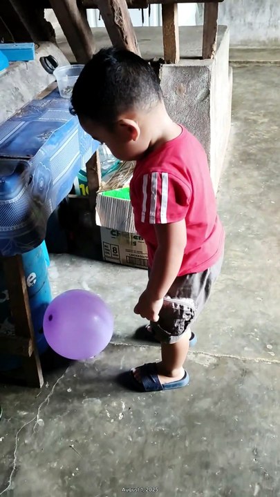 Isaiah playing balloon