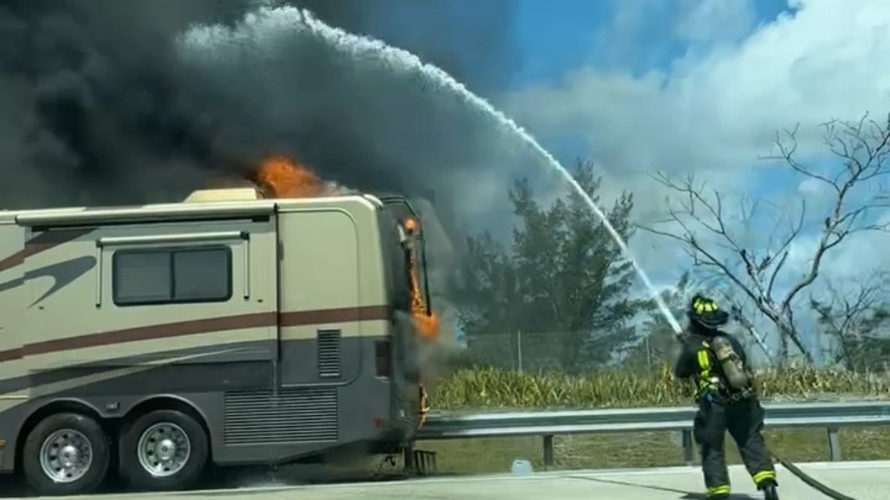 Firefighter Battle Flames As RV Is Consumed