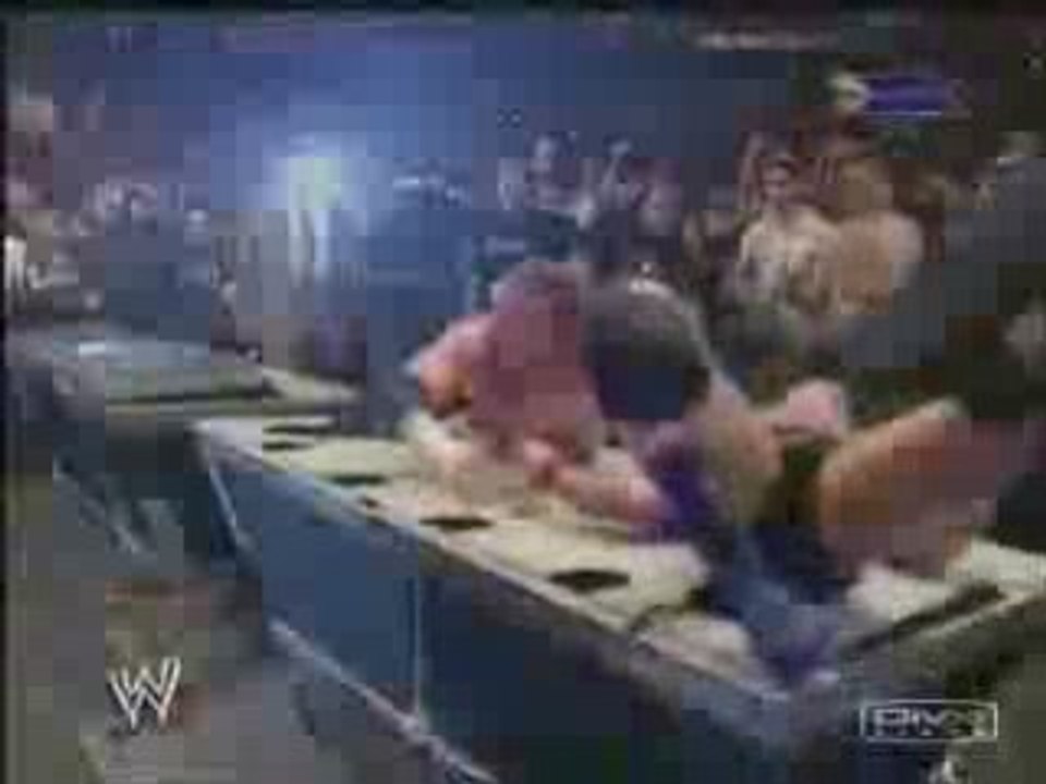 Triple H gets RKO'd through a table