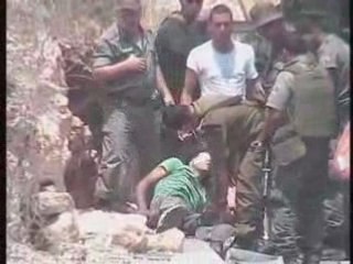 israeli soldier shoots palestinian detainee at close range