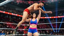 Powerful female wrestler pins a male wrestler down
