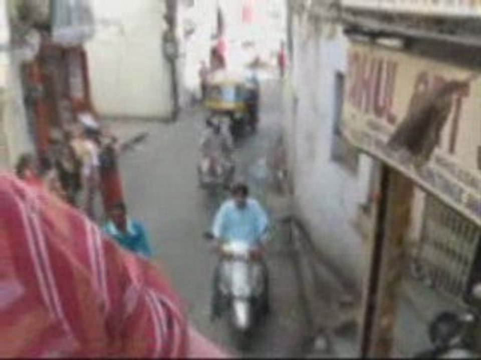Riding an elephant through a city centre in Udaipur India