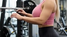 Barbell squat with model