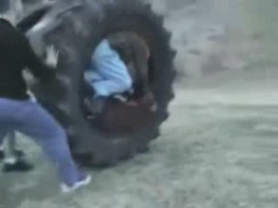 Kids Roll Down Hill in Tire