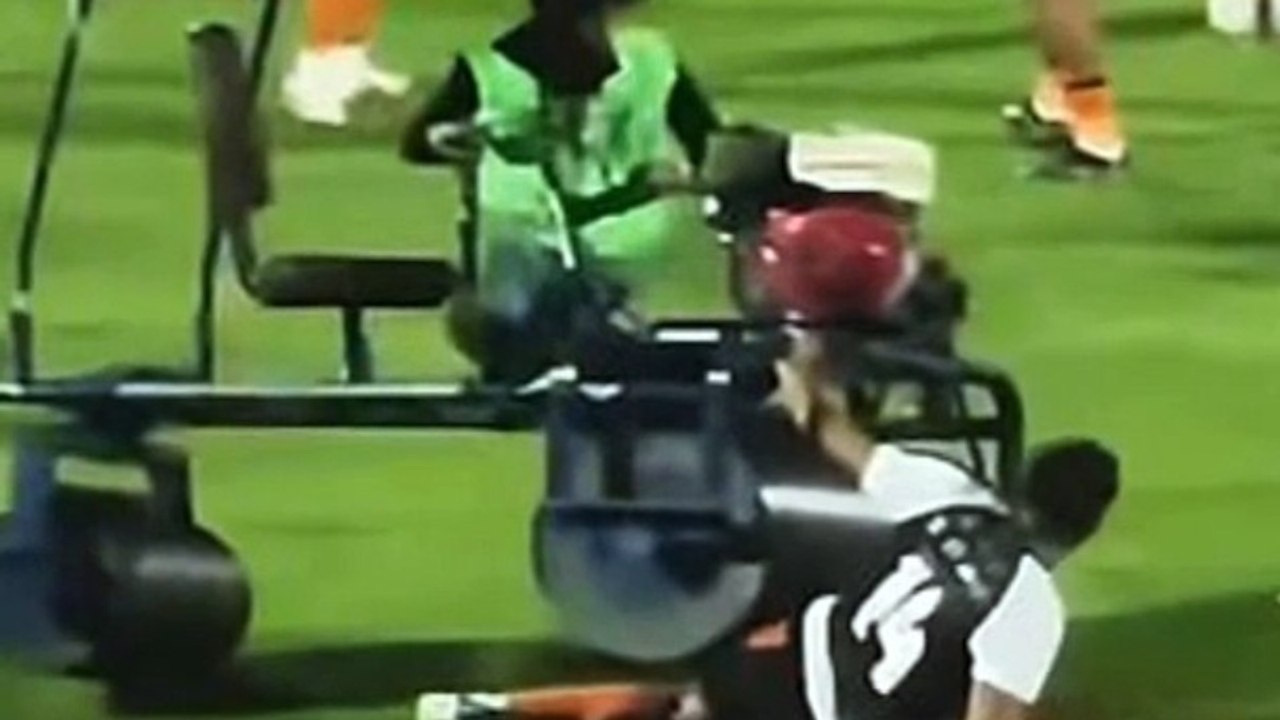 Bizarre moment former Premier League star is RUN OVER by a pitch rolling machine at half-time