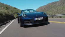 Porsche 911 Carrera S Convertible in Gentian Blue Metallic on the street