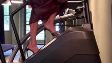 Victoria Beckham struts on Stairmaster in four-inch heels and leather skirt