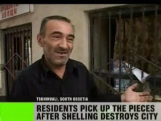 Residents pick up the pieces after shelling destroys city-RT