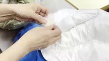 Реставрация повреждений пуховика Khrisjoy после крупного разрыва ткани на спине