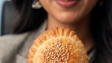 Pirya_biting_fried_pastry_wrap
