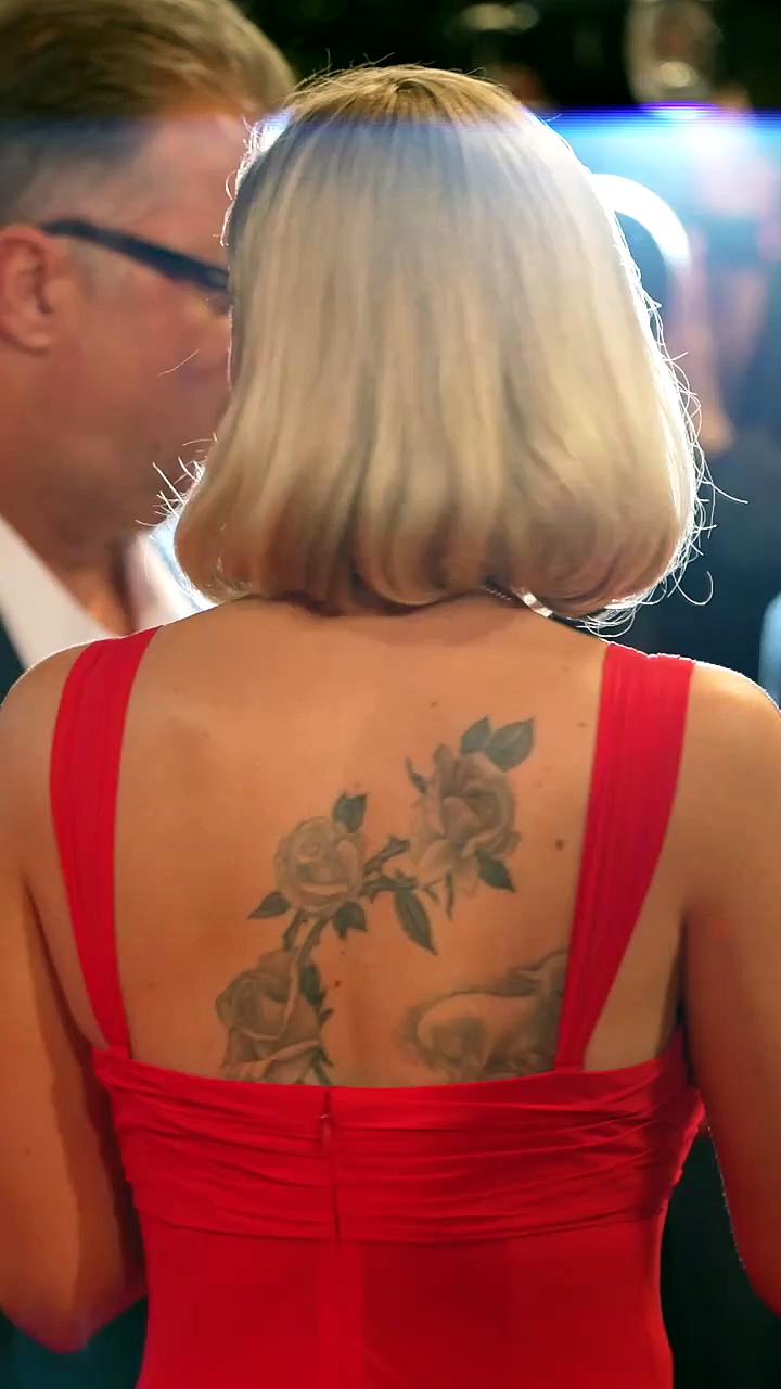 Scarlett Johansson's reveals huge back tattoos in stunning red dress