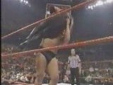 WWE - Big Show chokeslams Undertaker through ring