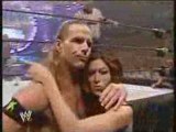 Shawn micheals puts his arm round melina