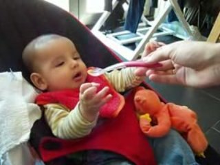 Maxime grabs spoon at almost 4 months