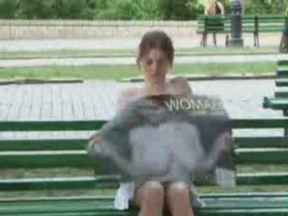 Topless on a park bench