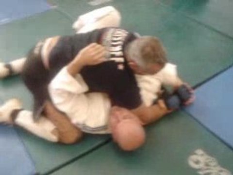 Passage de garde de jambe et clé de bras