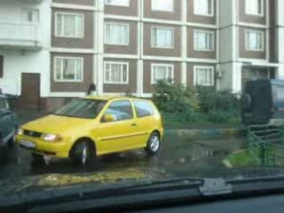 A woman parks a car