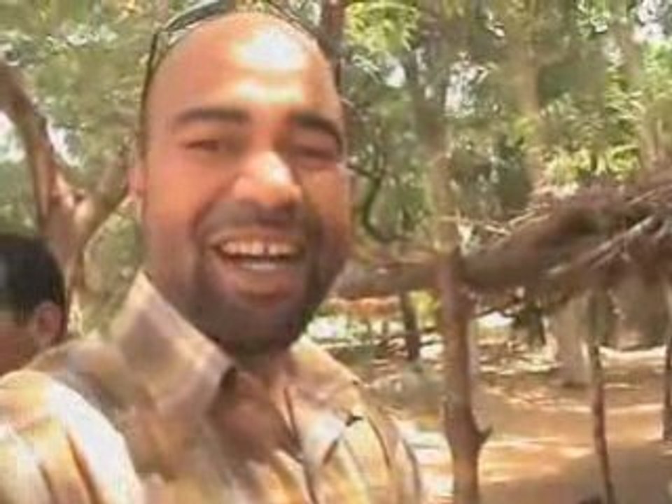 Marwan Talodi with people making money