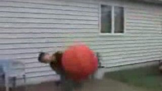 Kid Gets Rocked by Huge Orange Ball