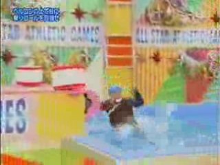 Japanese game show rope swing over hot water