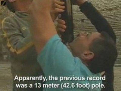 Man Balances 16-Meter Pole On Chin