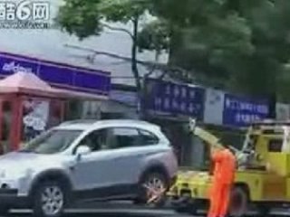 Woman in SUV Owns Tow Truck Guy