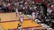 Dwyane Wade leaps right over his teammate for this block.