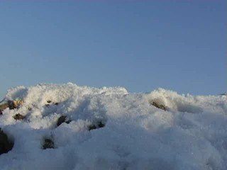 White snow on the rock