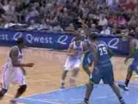 NBA Deron Williams somehow finds Paul Millsap down low.