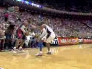 NBA LeBron James blows by Howard for the baseline jam.